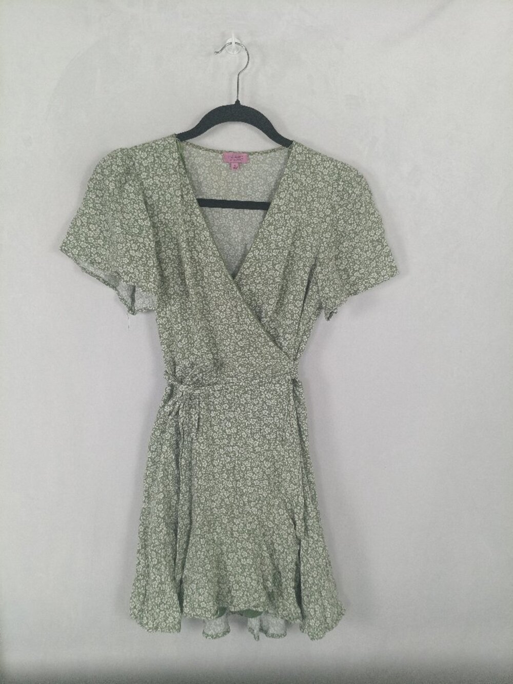 Francesca's sage green mini wrap dress